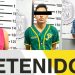 Three Mugshots in a Lineup with Height Markers; Eyes Obscured by Bars, Wearing Pink Sleeveless Top, Green Jersey, and Blue Patterned Shirt, with 'detenidos' Visible Below. - Capitanes Regios